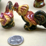 Rosemeade figure roosters and a nickle